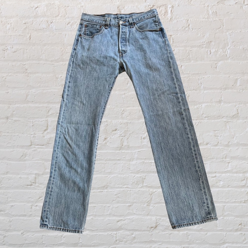 Levi's 501 button-fly men's jeans in a light wash